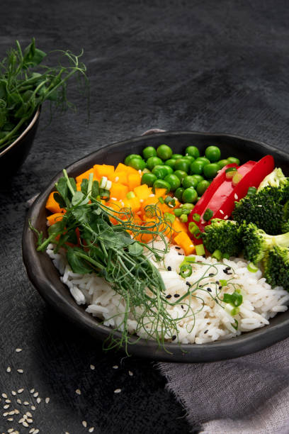 istock Bowl with rice, broccoli , pumpkin and microgreens. 1365532731