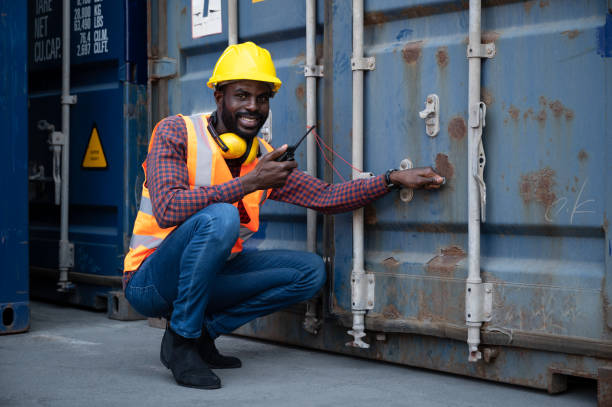 istock Engineering businessman use walkie talkie blue containers background 1365534507