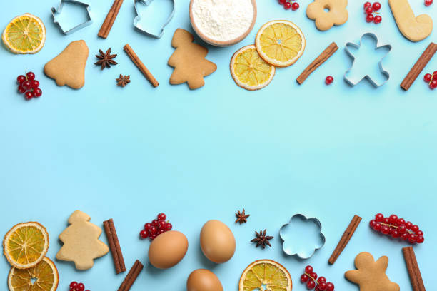 istock Frame of Christmas cookies and flour on light blue background, flat lay. Space for text 1365537332