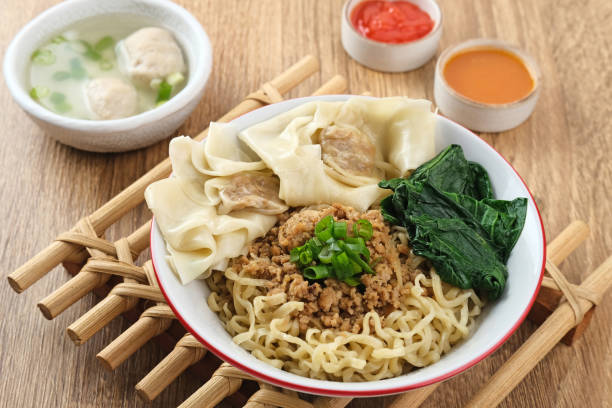 Mie ayam (noodles with chicken, meatballs, dumplings and vegetables) is a popular street food in Indonesia.