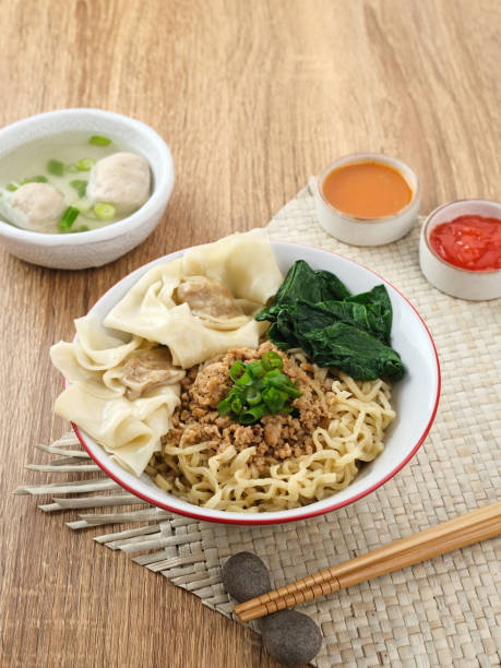 Mie ayam (noodles with chicken, meatballs, dumplings and vegetables) is a popular street food in Indonesia.