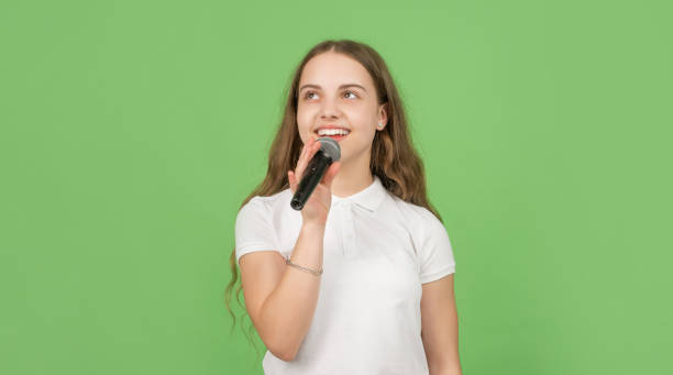 istock karaoke music. wireless audio accessory. childhood development. 1365541306