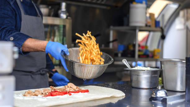 istock Cook working in a food truck 1365542320