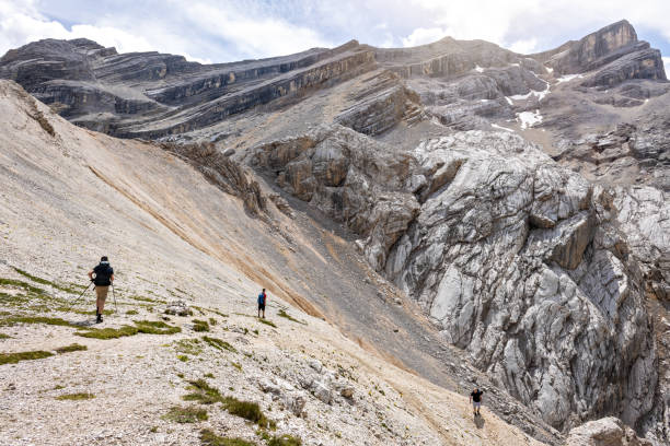 istock Hikers on their way down from a rough mountain top 1365542442