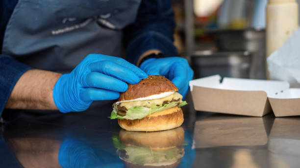 istock Cook working in a food truck 1365545310