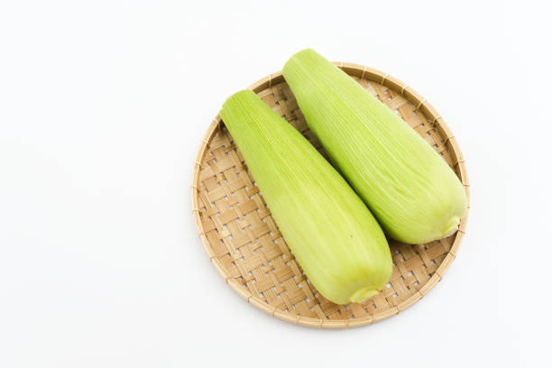 Organic sweet corn isolated on a white background. Copy space.