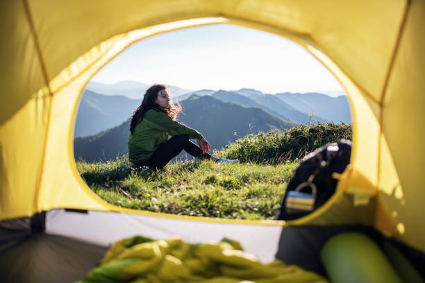 istock Woman on a camping in the mountains. 1365547095