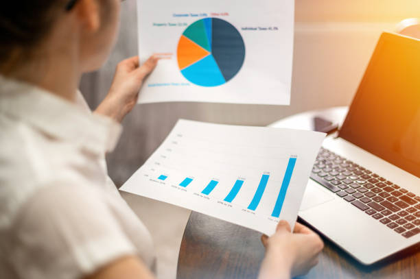 istock Woman working with finance diagrams on the table 1365548252