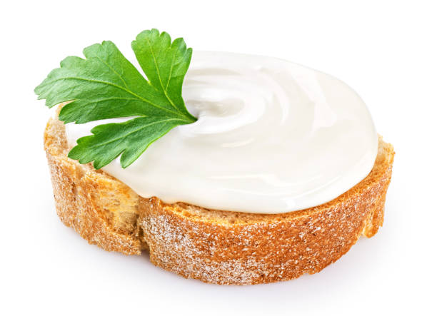 istock Toasted bread with cream cheese and parsley isolated on white background. With clipping path. 1365548882