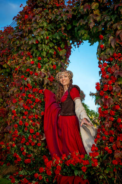 istock A beautiful blond princess in a secret rose garden setting 1365548883