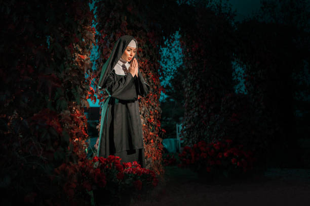 istock A beautiful brunette nun in a secret rose garden setting 1365549045