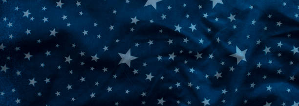 istock Dark blue textile background with white stars. Banner. 1365549928