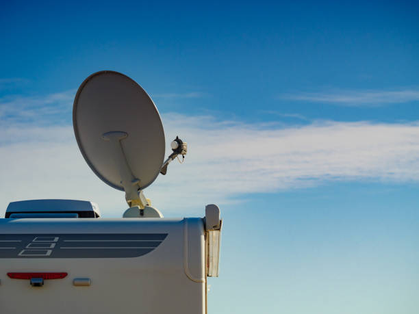 Satellite dish on roof of caravan stock photo