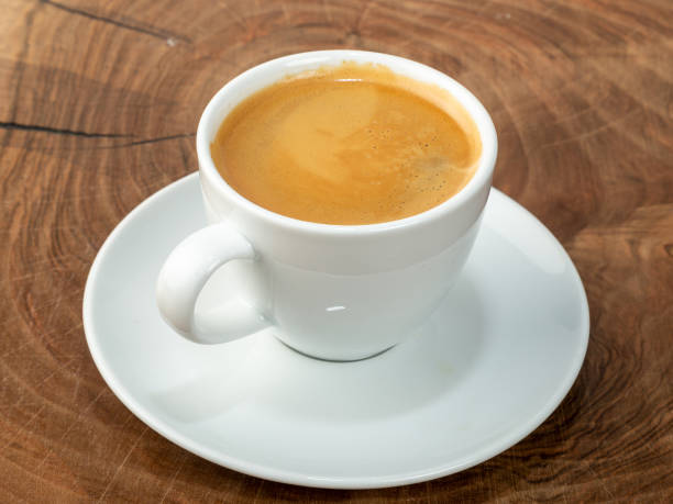 istock coffee in white cup with wood background 1365550097