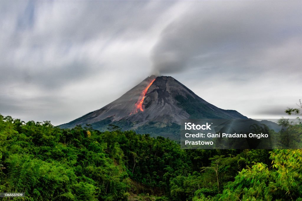 Lava flow from Merapi Volcano, Indonesia Incandescent lava avalanches from the lava dome of Mount Merapi, Yogyakarta, Indonesia Volcano Stock Photo