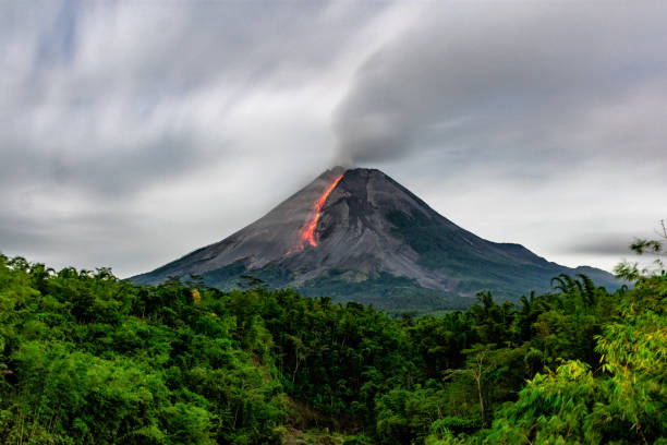 Lava flow from Merapi Volcano, Indonesia Incandescent lava avalanches from the lava dome of Mount Merapi, Yogyakarta, Indonesia volcanic landscape stock pictures, royalty-free photos & images