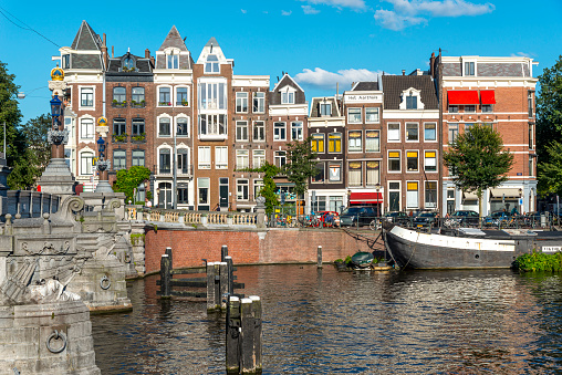 Canal in Amsterdam, Netherlands. houses at the river Amstel, landmark old European city,  spring landscape.