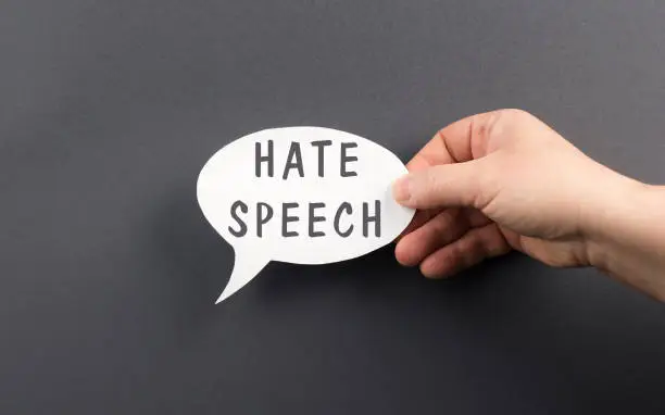 Photo of The words hate speech are standing on a speech bubble, political correctness, racism, defamation