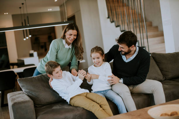 istock Siblings fighting over TV remote control at home 1365554479