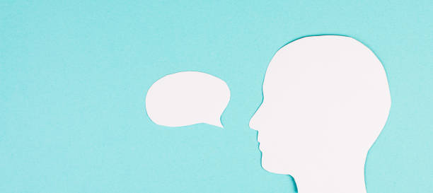 istock Silhouette of a face, speech bubble in white color, copy space for text, communication, having an opinion, free speech 1365555762