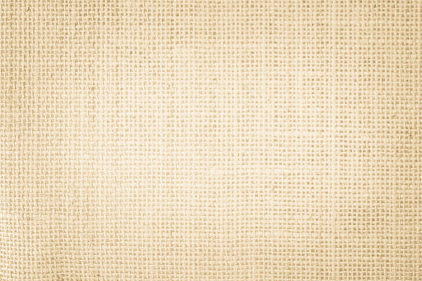 istock Jute hessian sackcloth burlap canvas woven texture background pattern in light beige cream brown color blank. Natural weaving fiber linen and cotton cloth texture as clean empty for decoration. 1365556052