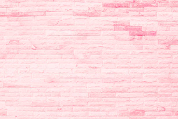 istock Empty Pink brick wall texture background in the bedroom at lovely. Brickwork stonework interior, rock old clean concrete grid uneven abstract weathered brick design, horizontal architecture wallpaper. 1365556187