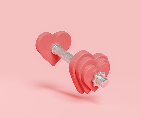 dumbbell with weights in the shape of a heart. minimal concept of exercise, healthy life, love and valentine's day. 3d rendering