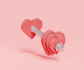 dumbbell with weights in the shape of a heart
