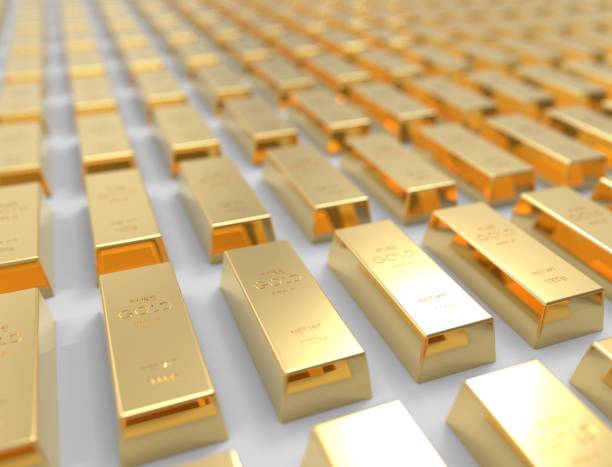 istock 3D rendering of gold bars isolated on white studio background 1365559685