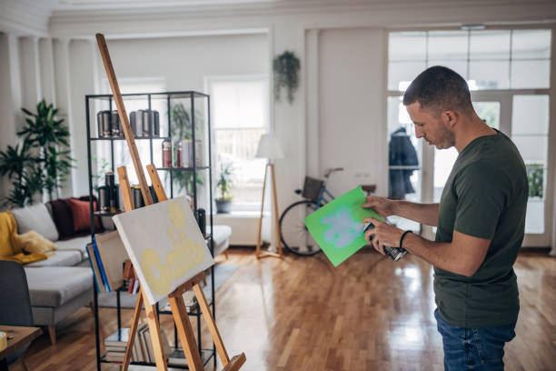 istock Male artists spray painting 1365559776