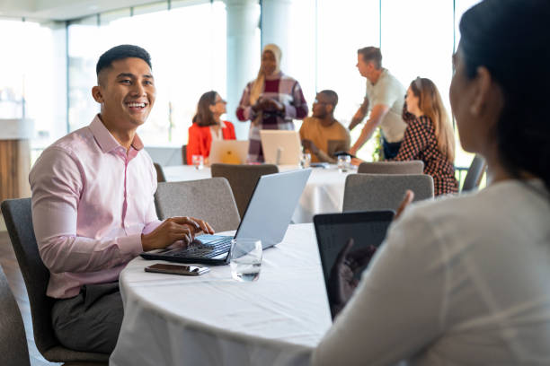 istock Talking Business with a Colleague 1365562632