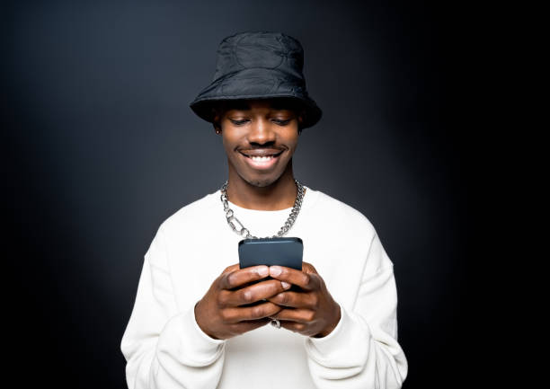 istock Smiling young man wearing white sweatshirt 1365562880