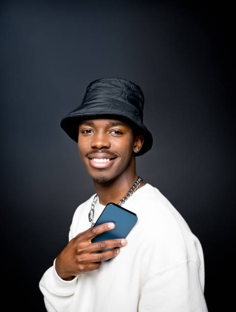 istock Smiling young man wearing white sweatshirt 1365563590