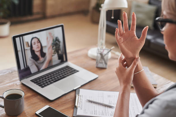 istock Doctor Working With Woman Online 1365563981