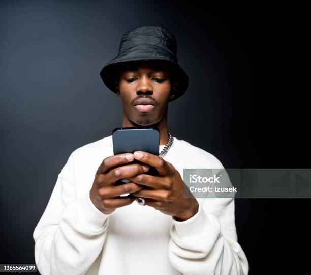 Young Man Using Smart Phone Stock Photo - Download Image Now - Using Phone, African-American Ethnicity, Telephone