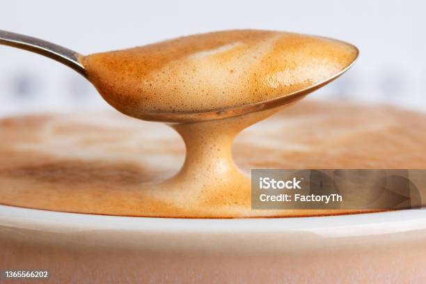 Cup Latte Coffee With Spoon Of Foam Stock Photo - Download Image Now - Crema - Coffee, Cafe, Close-up