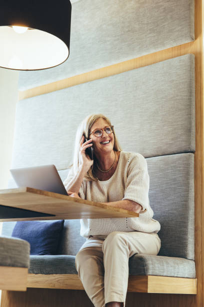istock Experienced businesswoman taking a phone call 1365566705