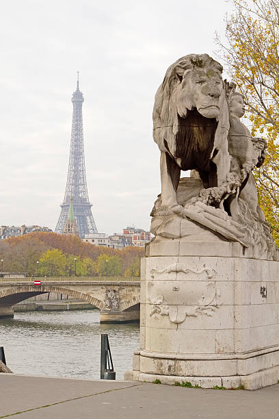 Eiffel Tower and Lion Statue stock photo