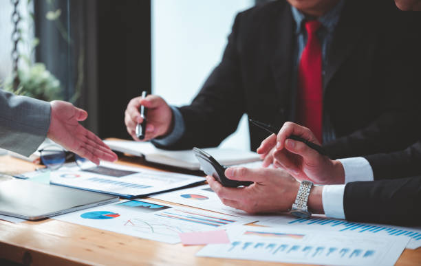 istock Businessmen meeting together, thinking, analyzing projects at the office. 1365567680