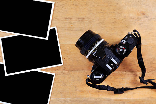istock Old film camera and photo paper 136556774