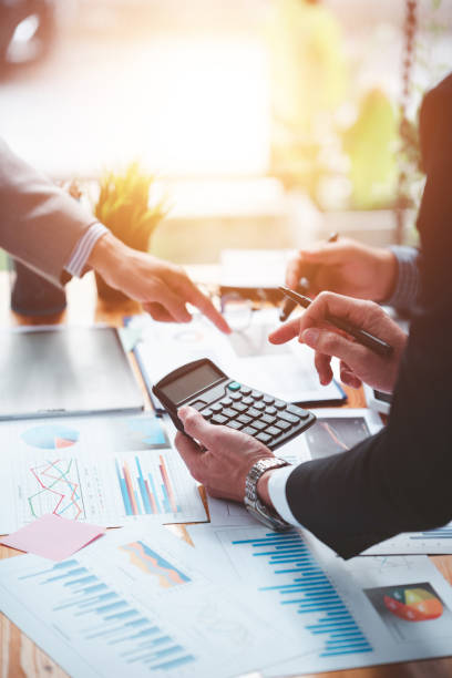 istock Businessmen meeting together, thinking, analyzing projects at the office. 1365567821