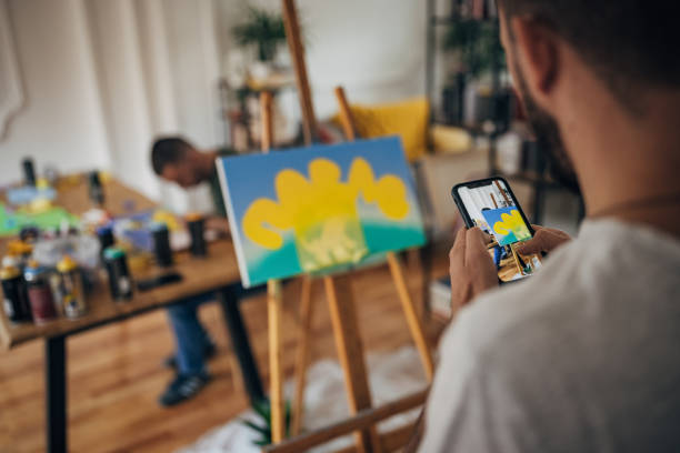 istock Artist photographing his work 1365569048