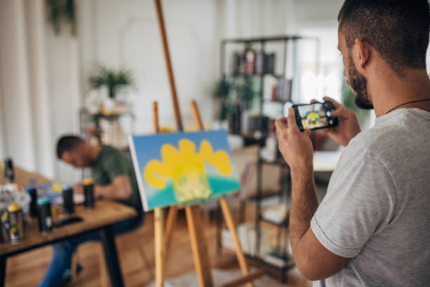 istock Artist photographing his work 1365569064