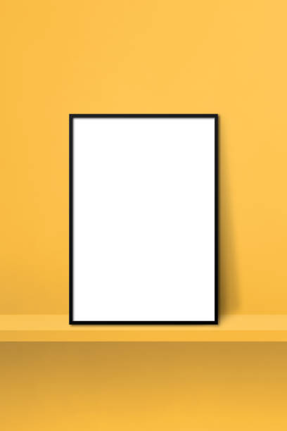 istock Black picture frame leaning on a yellow shelf. 3d illustration. Vertical background 1365570566
