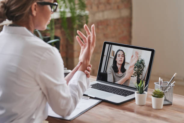 istock Doctor Consulting Young Woman 1365570651