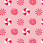 istock Christmas peppermint swirl candies seamless pattern. 1365571136