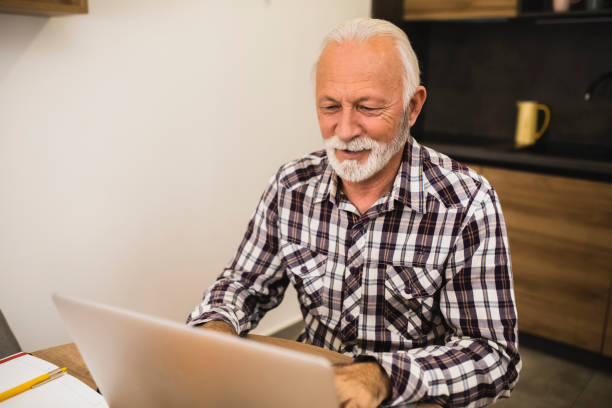 istock Senior businessman cooperating with his clients online 1365574550