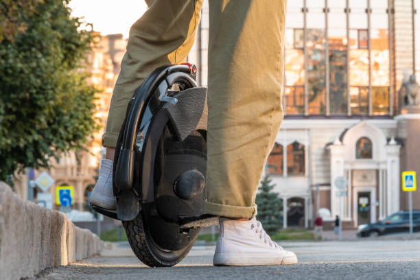 istock a young woman on electric unicycle (EUC) 1365574759