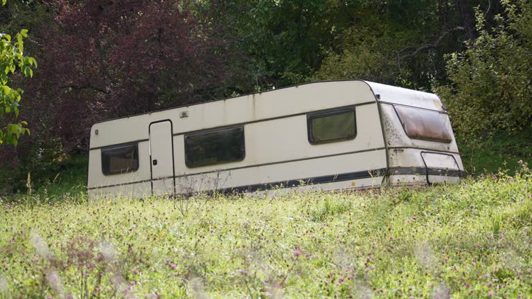 An old abandoned white trailer