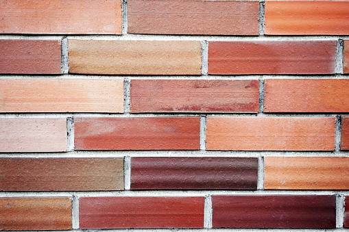 Brick wall with bricks of various colors. Background, pattern, texture